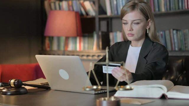 Female Lawyer Doing Online Shopping on Laptop