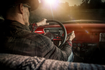 Cowboy Behind the Wheel of a Classic Pickup Truck - obrazy, fototapety, plakaty
