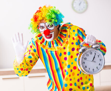 Male clown preparing for perfomance at home