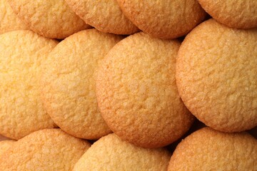 Delicious butter cookies as background, top view