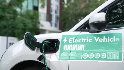 Electric car recharge at charging station for electricity by EV charger display digital battery status hologram cable in public car park. Future innovative ev car and energy sustainability. Peruse