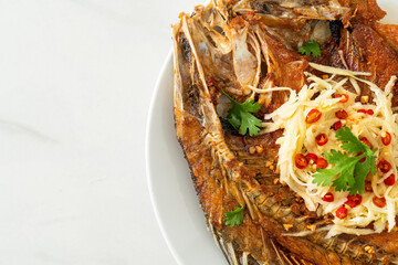 Fried Sea Bass Fish with Fish Sauce and Spicy Salad