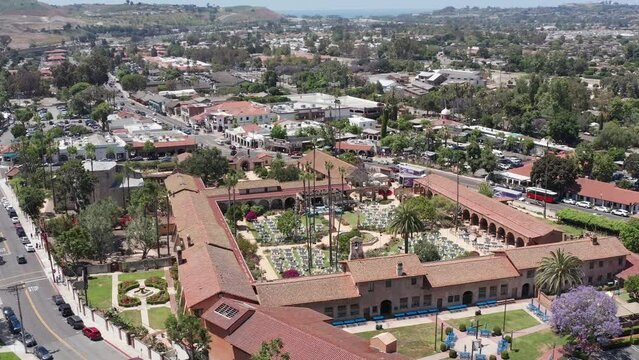 Aerial wide rising and panning shot of the Mission San Juan Capistrano in California. 4K