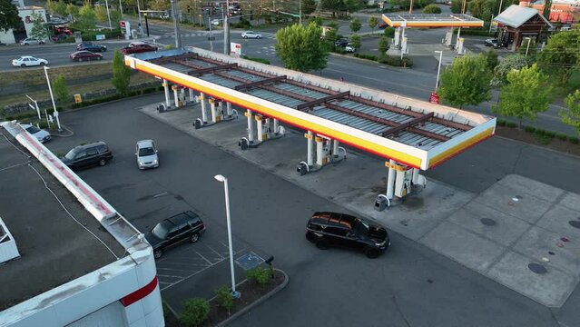 Aerial view of Americans filling up their cars at the local gas station.