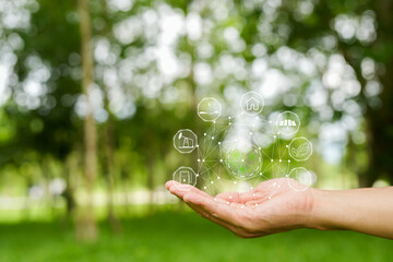 Technology, hand holding with environment Icons over the Network connection on green background.