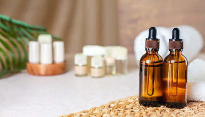Bottles on the background of the spa room. Skin care serum or natural cosmetics with essential oil. face and body beauty concept. Spa concept. Place for text.