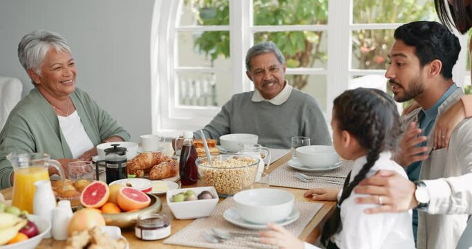Breakfast, hug and morning with big family at table for food, gratitude and wake up. Love, support and brunch with people eating in dining room at home for nutrition, wellness and health