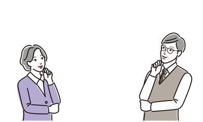 向き合って考える老夫婦