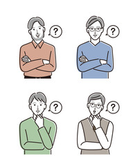 腕組みをして考えるシニア男性