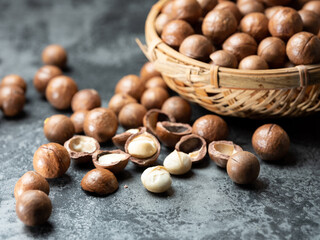 Roasted macadamia nuts on a dark background