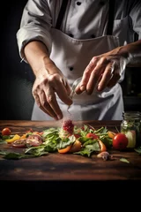 Fotobehang Closeup chef hands preparing a fine dining dish with ingredients © Jeremy