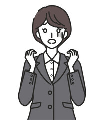 怯えるスーツを着た女性