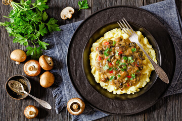 potato mash topped with mushroom gravy in bowl