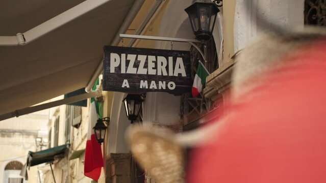 Pizza sign, entrance of a pizzeria in Corfu.