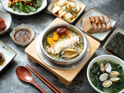 Korean traditional food, various side dishes and abalone pot rice