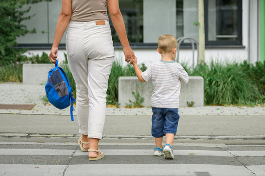 Crop images of mother with son crossing street