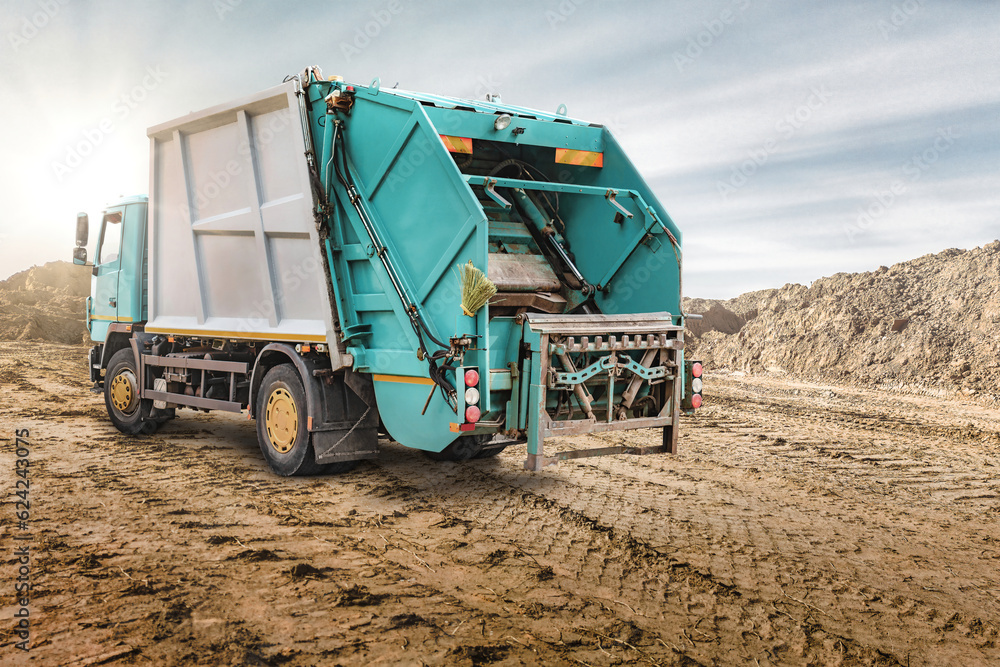 Poster a large garbage truck brought the garbage to the quarry for temporary storage. powerful modern techn