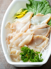 whelk Sashimi on a plate