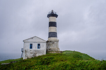 Fototapeta na wymiar lighthouse on a hill