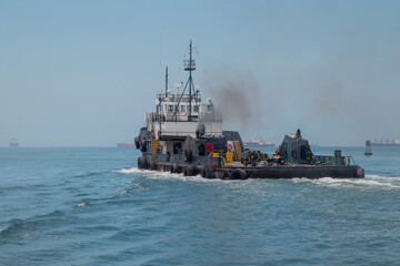 Obraz premium special platform ship or tug, with rear portion of the ship low, flat and wide, to accomodate wide loads and possibility of hauling something big.