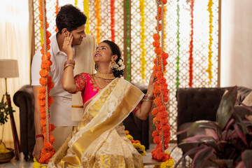 South Indian couple celebrating Onam at home