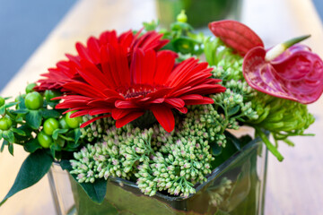 Flower in glass pot on a table