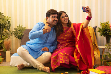 Sibling taking selfie together on Raksha Bandhan
