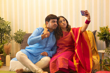 Sibling taking selfie together on Raksha Bandhan
