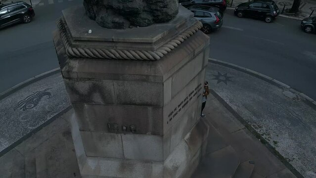 Aerial bottom up view of central square which includes the statue of Pedro &Aacute;lvares Cabral and sign that welcomes people in Lisbon.