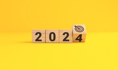 The year 2024 target dart on yellow background. 2024 business planning and strategy concept. investment trends next new year.