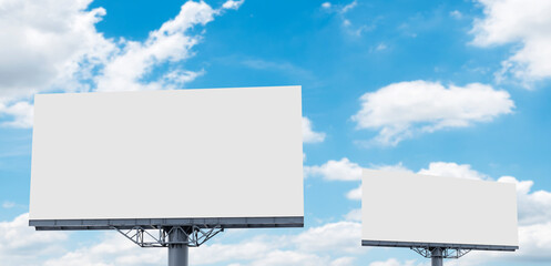 Fototapeta premium Two pole outdoor billboard with blue sky background