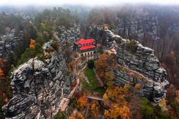 Hrensko, Czech Republic - Aerial view of the famous Pravcicka Brana (Pravcicka Gate) in Bohemian Switzerland National Park, the biggest natural arch in Europe on a foggy autumn day