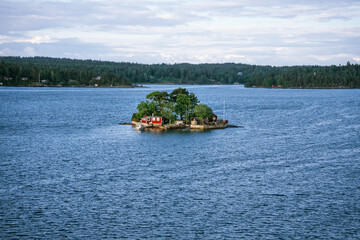 Typical red timber house on an islands of the Stockholm Archipelago in Sweden