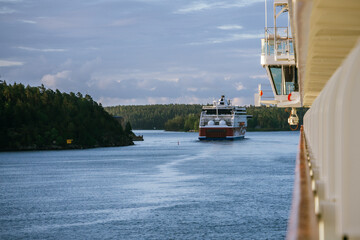 Cruise ship following a ferry through the Stockholm Archipelago in Sweden
