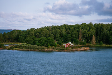 Typical red timber house along the coastline of Åland Islands, Finland