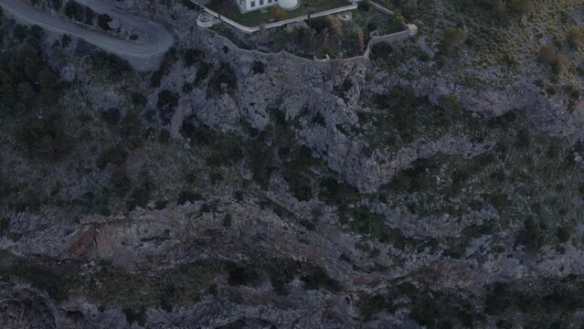 Aerial view of Far des Cap Gros at Port de S&oacute;ller Mallorca with soft light, drone shot