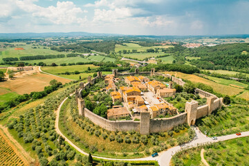 Beautiul aerial view of Monteriggioni, Tuscany medieval town on the hill. Tuscan scenic landscape  with ancient walled city Monteriggioni, Italy.