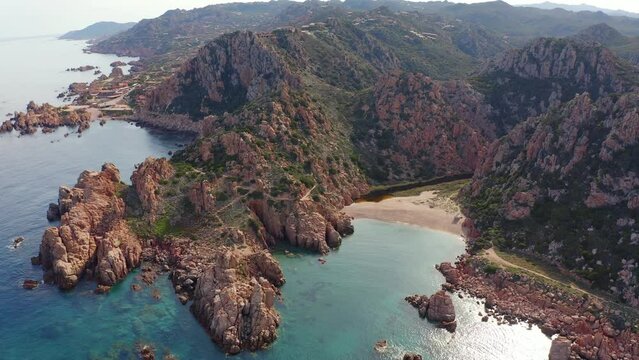 4k drone forward video (Ultra High Definition) of Costa Paradiso, Sardinia island, Italy, Europe. Gorgeous morning scene of Li Cossi beach. Wonderful Mediterranean seascape.