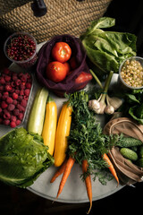 layout of seasonal vegetables and berries from the farmer's market. lay out food on the table after purchase. buy fresh vegetables	