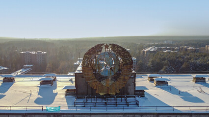 Roof of building with soviet symbol in Pripyat, abandoned city