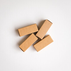 Four brown cardboard boxes with shadow. Top view, copy space.
