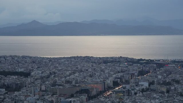 View of Athens, Aegina island and peloponnese from Lycabettus hill at sunset, Greece. 
