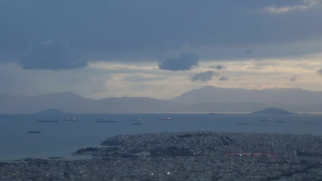 View of Athens, Aegina island and peloponnese from Lycabettus hill at sunset, Greece. 
