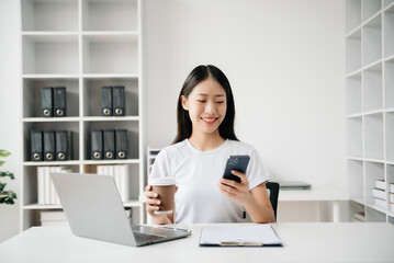 Business woman using tablet and laptop for doing math finance on an office desk, tax, report, accounting, statistics, and analytical research concept in office