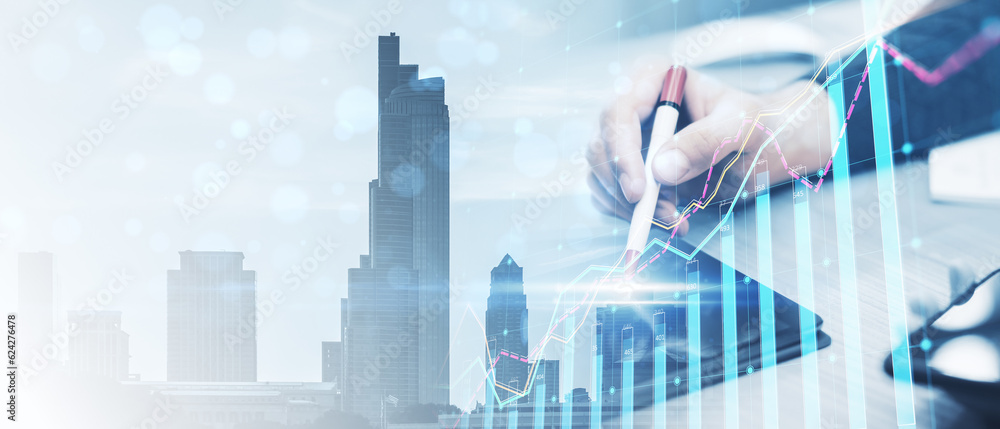 Poster wide image of office workplace with close up of male hands using device and forex chart on creative 
