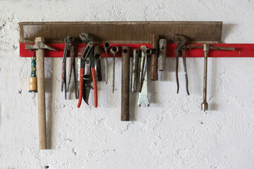 Old work tools hanging on the wall