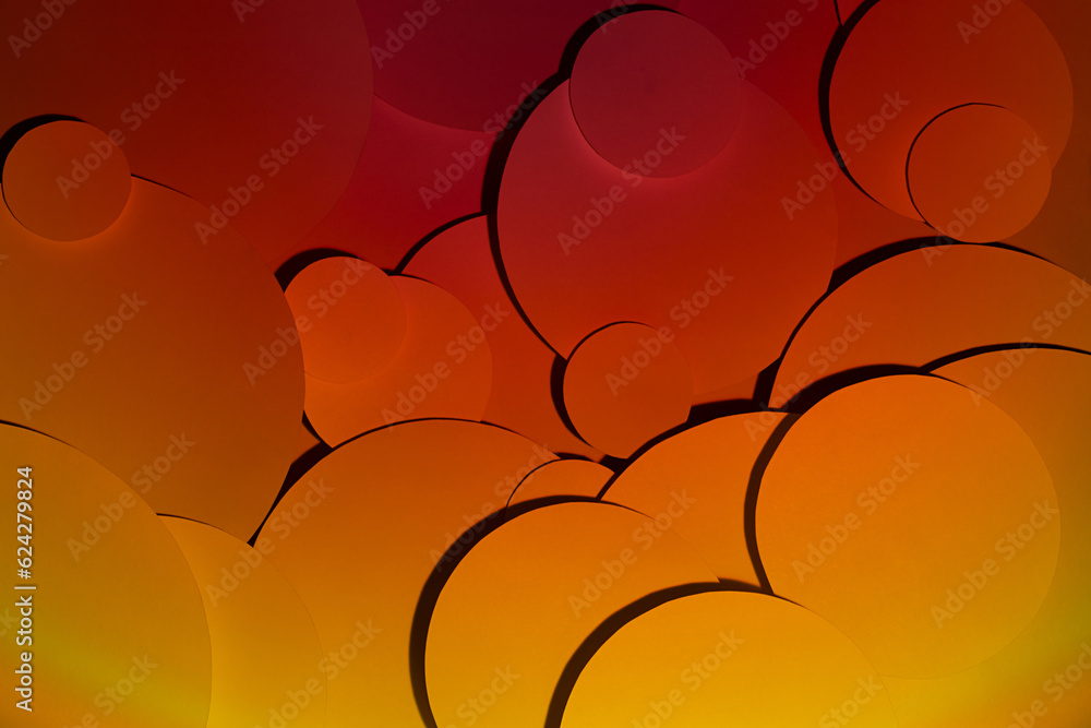 Poster deep orange yellow red abstract background of fly paper circles pattern of different size, top view,