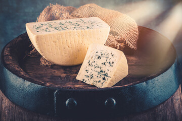 Cheese collection, piece of gorgonzola cheese with blue mold close up - 624281031