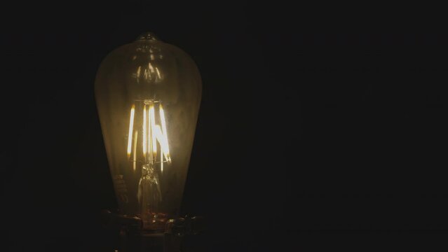Edison lamp. Incandescent thread. To turn on the light. Warm lighting. The emergence of an idea. New thoughts. Brainstorm.