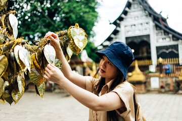 Asian traveller take a photo to Pagoda of wat lok moli temple in Chiang mai city, Thailand